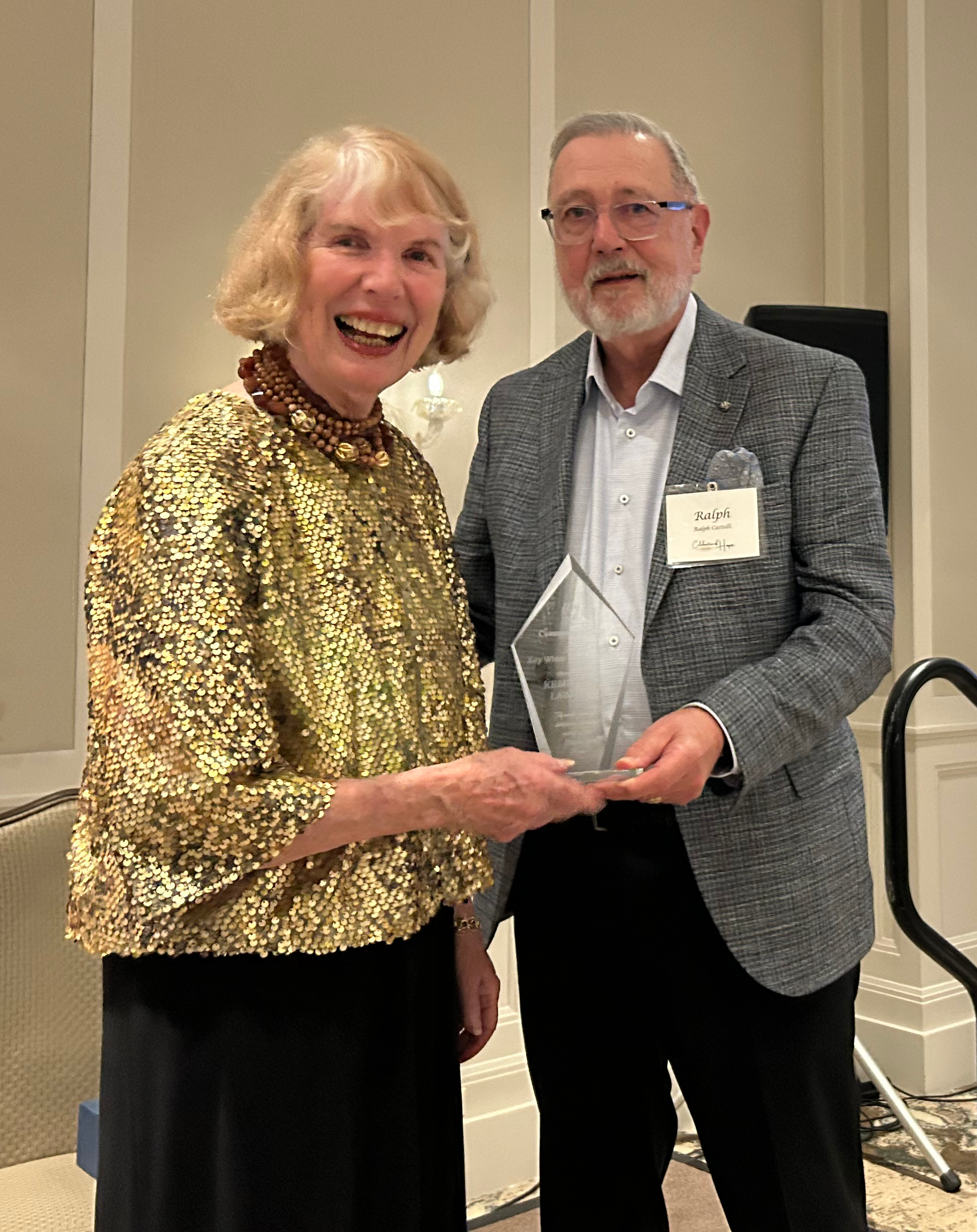 Kay White presents Ralph A. Castelli, CEO Emeritus of Kemp Klein, with the Kay White Legacy Award at Common Ground’s Celebration of Hope Gala.